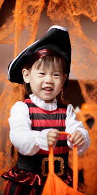 Toddlers dressed in pirate and ghost costume for Halloween party
