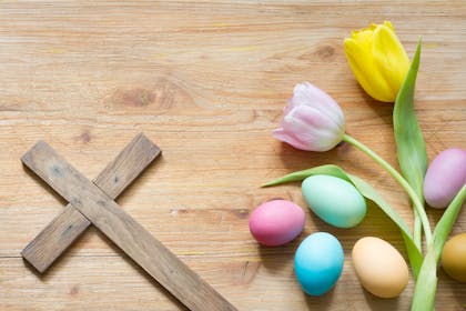 Easter eggs and flowers with cross