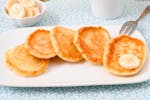 Mini pancakes for babies with sliced banana