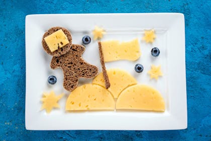 Astronaut made from bread and planet and stars made from cheese