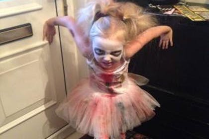 A girl dressed as a zombie ballerina