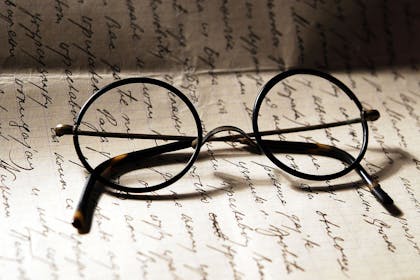 Harry Potter glasses on page of writing
