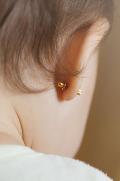 A baby with pierced ears