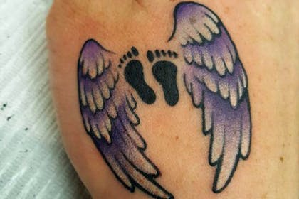 Wings and footprints miscarriage tattoo