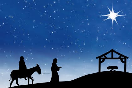 A nativity scene of Mary and Joseph at night