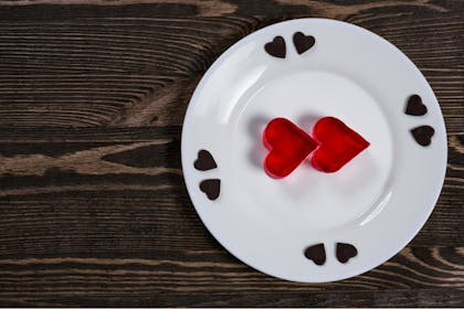 Jelly shaped like two red hearts on a dinner plate