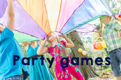 Children playing with parachute, text says Party Games