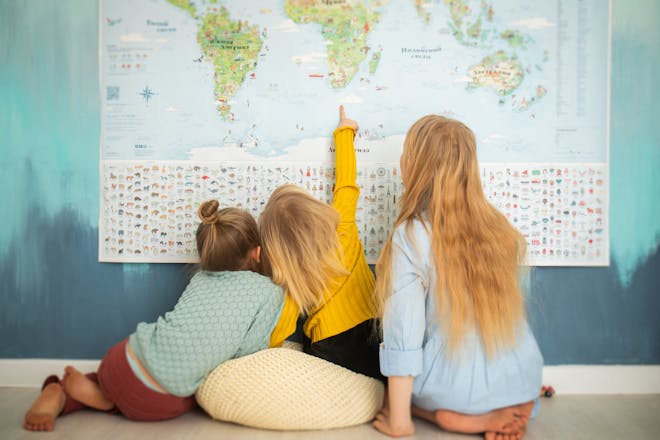 Kids studying world map