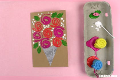 Handmade card with bunch of roses printed using rolled sponge stamps