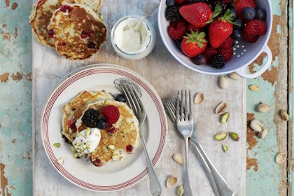 Oat and pistachio pancakes with fresh berries. Healthy pancakes recipe