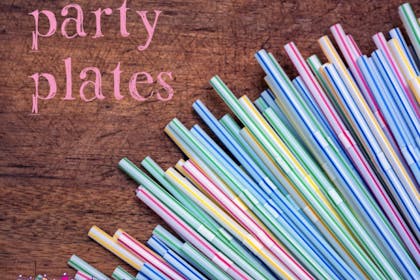 colourful drinking straws on wooden table