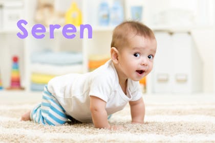 Baby crawling in playroom