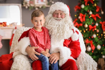 Boy sitting on Santa's knee