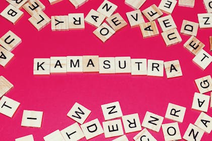The word Kamasutra written in scrabble tiles