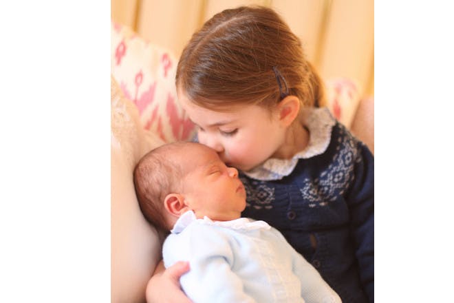 Princess Charlotte kissing Prince Louis