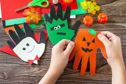 Halloween characters made using children's hand prints