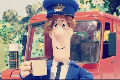 Postman Pat enjoying a mug of tea outside his van