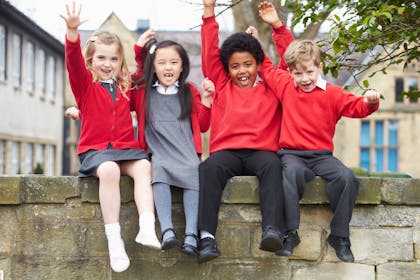 Primary school kids cheering together