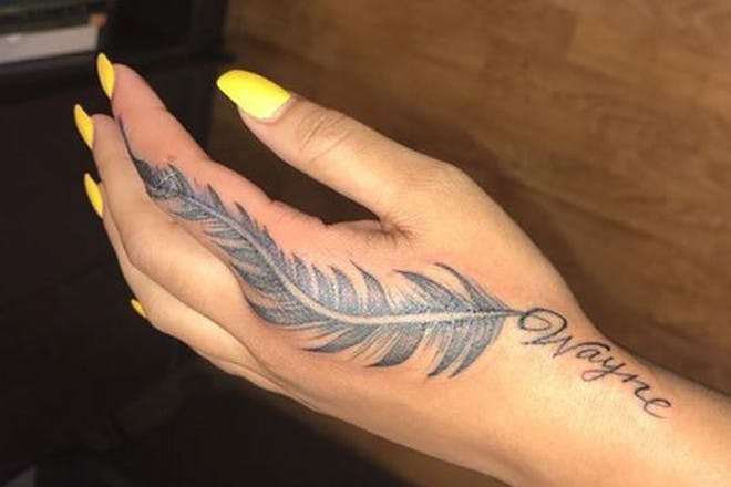 Hand feather tattoo