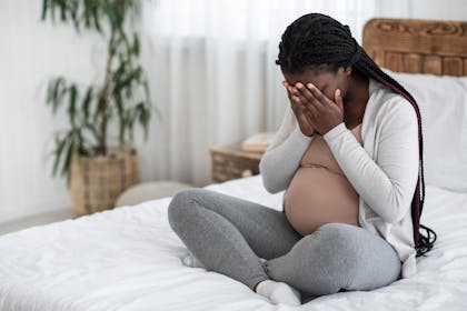 Pregnant woman crying