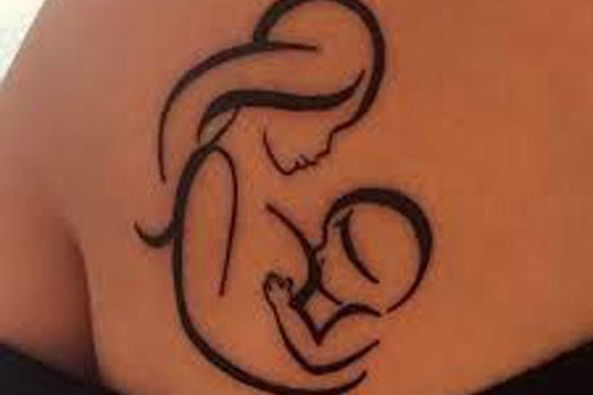 Mother breast feeding tattoo