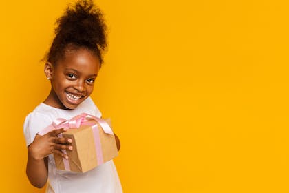 Young girl holding present