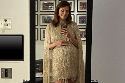 Ellie Taylor wearing gold sequinned dress