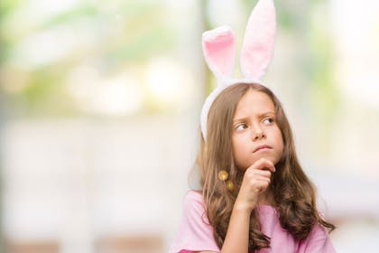Pensive girl with Easter bunny ears