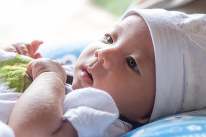 Newborn baby with hat on