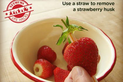 strawberries in bowl with husks removed