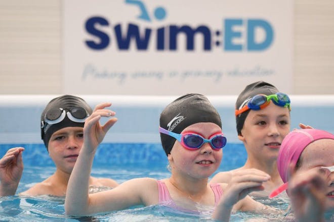 Primary school-aged kids learn to swim in a pop-up pool from Progressive Sports