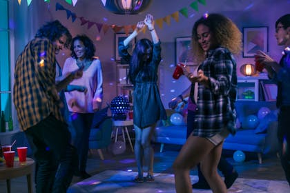 Young people dancing at a house party