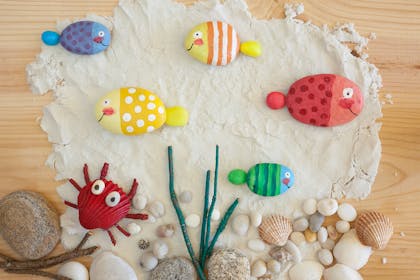 stones and shells painted to look like fish and crabs