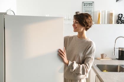 woman opening freezer