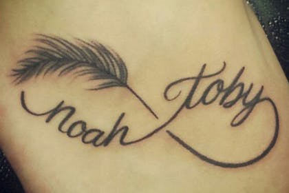 Feather and name tattoo