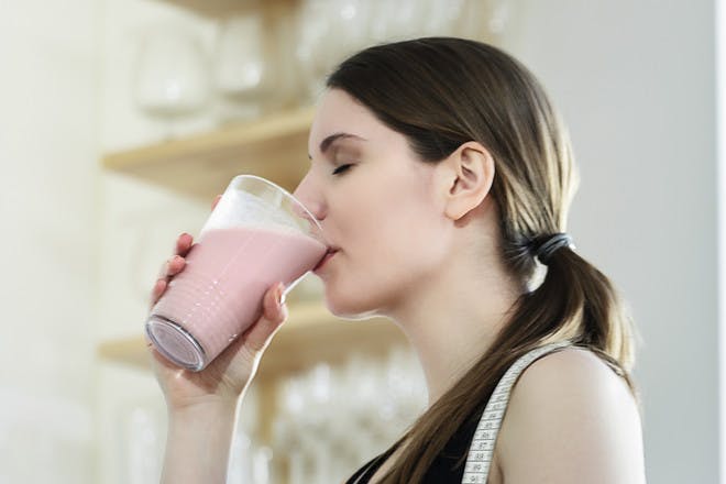 Woman drinking smoothie on Cambridge diet