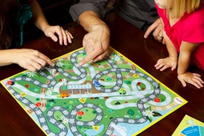 Family playing a board game