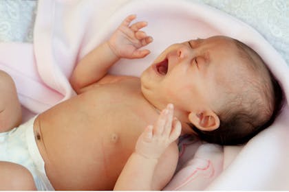 Baby with colic crying