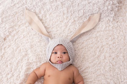 Baby dressed up as a rabbit with a bunny-ears hat