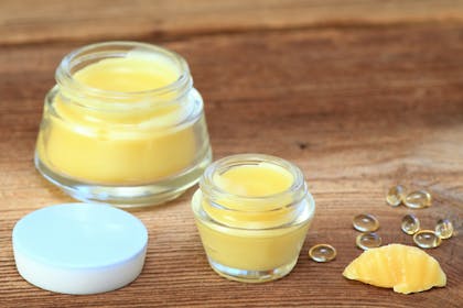 Two pots of homemade beeswax lip balm