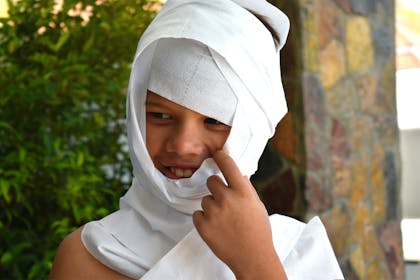 Child dressed up as a toilet paper mummy for Halloween