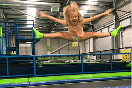 Girl jumping and doing splits in air