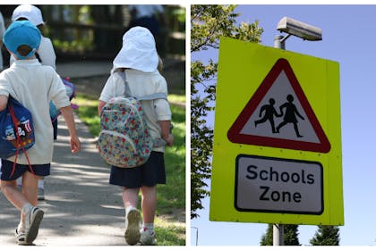 Children on way to school / school sign