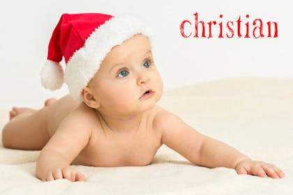 Baby wearing a Christmas Santa hat