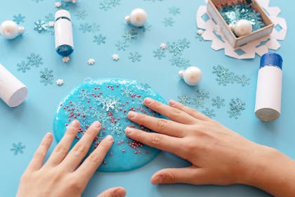 Child making slime with snowflakes in