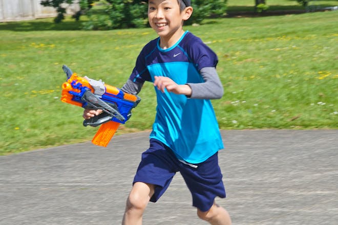 Kid running around with Nerf gun
