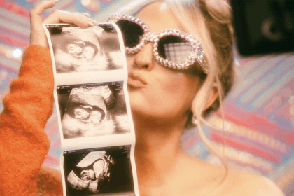 Meghan Trainor kisses baby scan photos wearing sparkly sunglasses