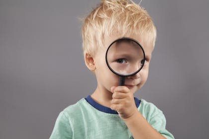 Boy with magnifying glass