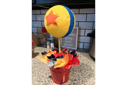 Toy Story table centrepiece made out of styrofoam ball and tissue paper
