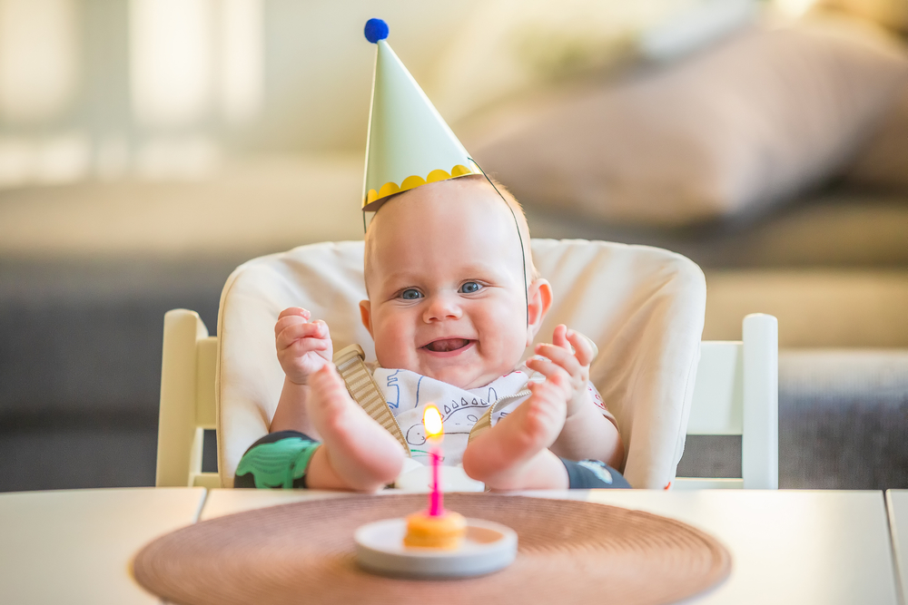 Baby in diaper eating birthday cake. Portrait of infant eating birthday cake  isolated over white background. | CanStock